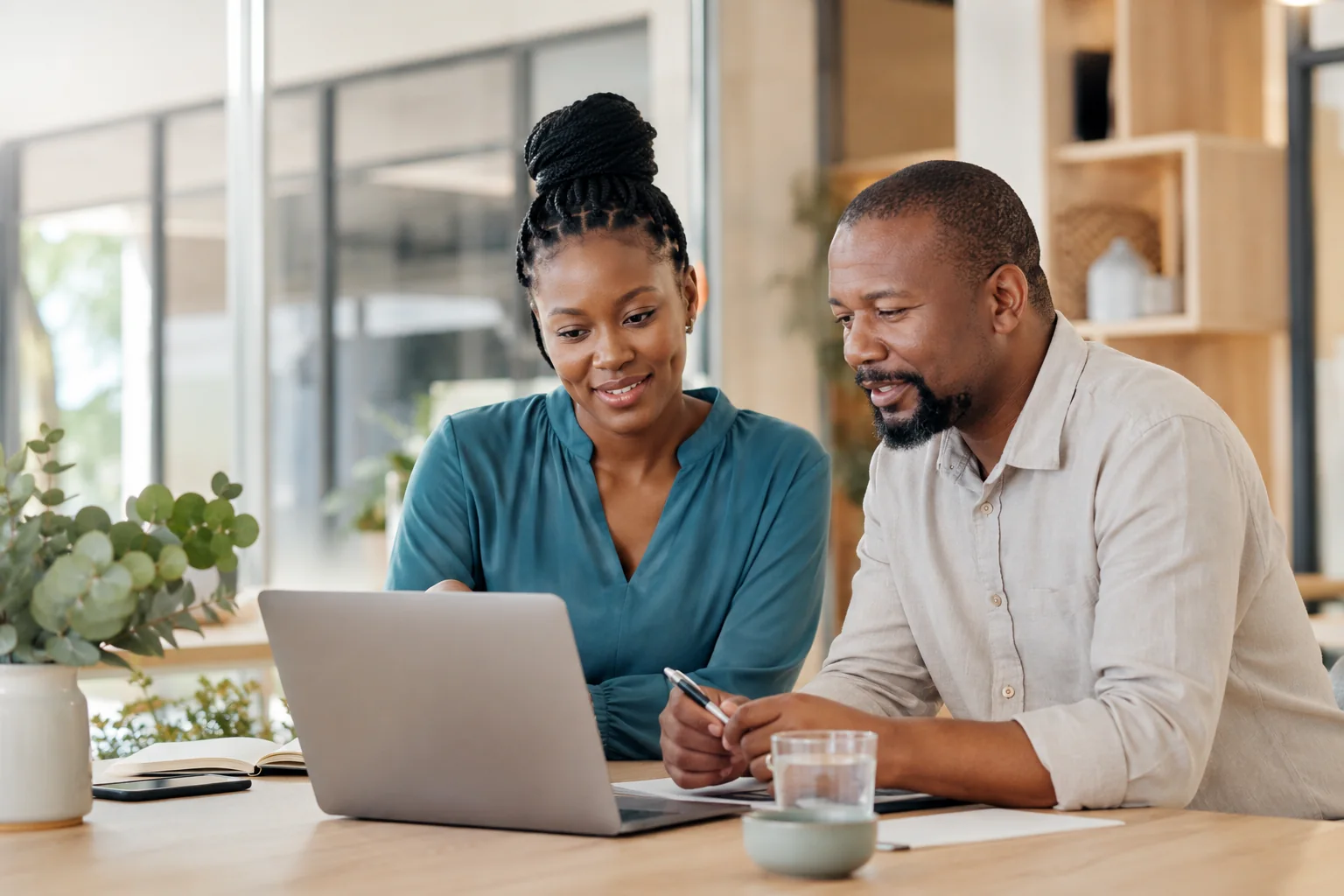 Botswana business owners reviewing work together